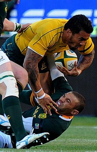 Australia's Digby Ioane (top) clashes with South Africa's Bryan Habana